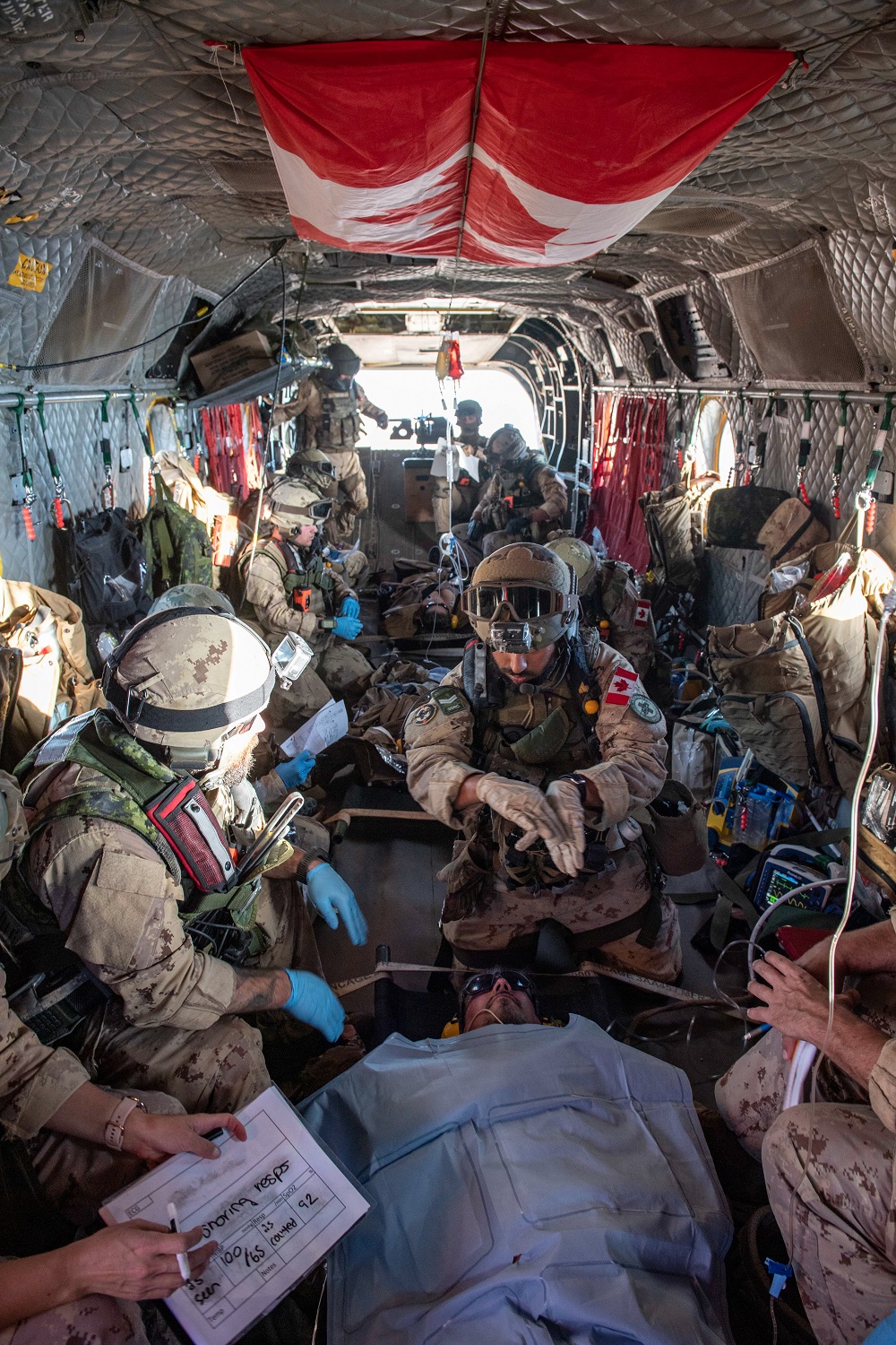 Military personnel in a helicopter